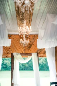 The Lofton 2025 Showcase Indoor Ceremony Barn Drapery with Chandeliers